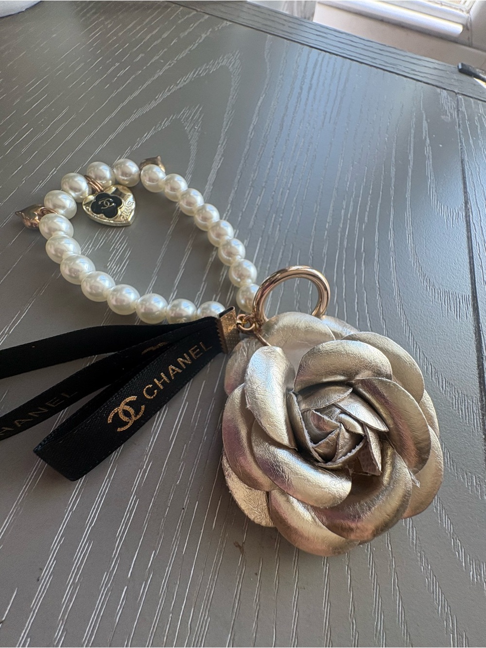 FaSHION GWP Pearl Bracelet Keyring with Gold  Camellia Charm and Black Ribbon